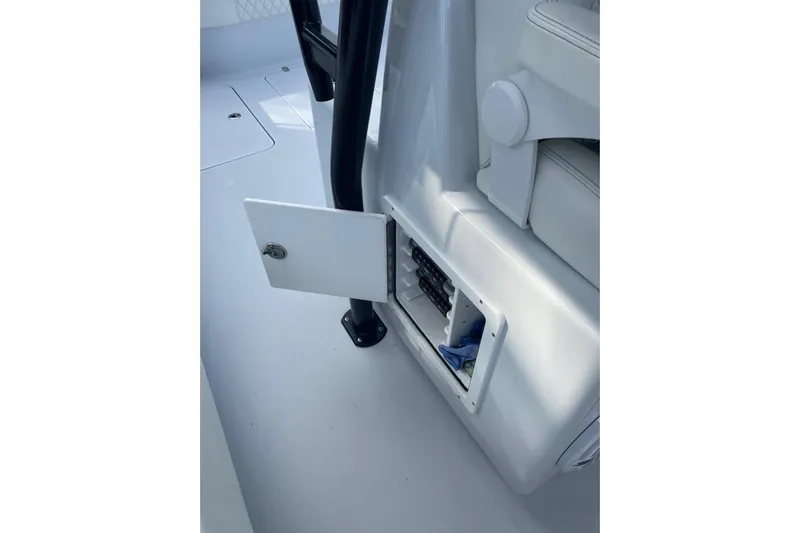  Yacht Photos Pics 2023 Conch 41 Center Console interior storage compartment with open door.