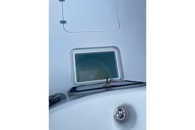  Yacht Photos Pics 2023 Conch 41 Center Console boat compartment with hatch and latch detail.