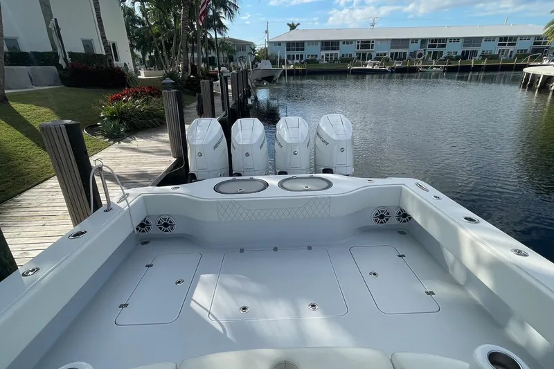 Yacht Photos Pics 2023 Conch 41 Center Console boat docked, featuring spacious deck and powerful engines.