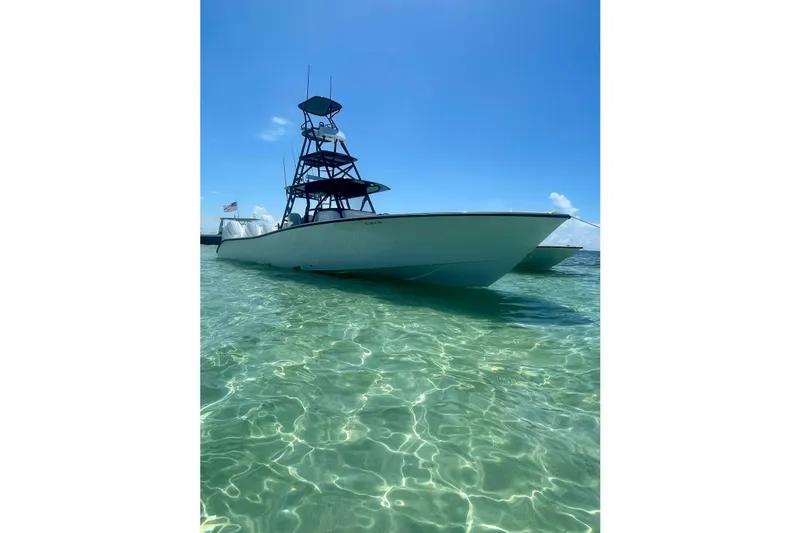  Yacht Photos Pics 2023 Conch 41 Center Console boat on clear water under blue sky.