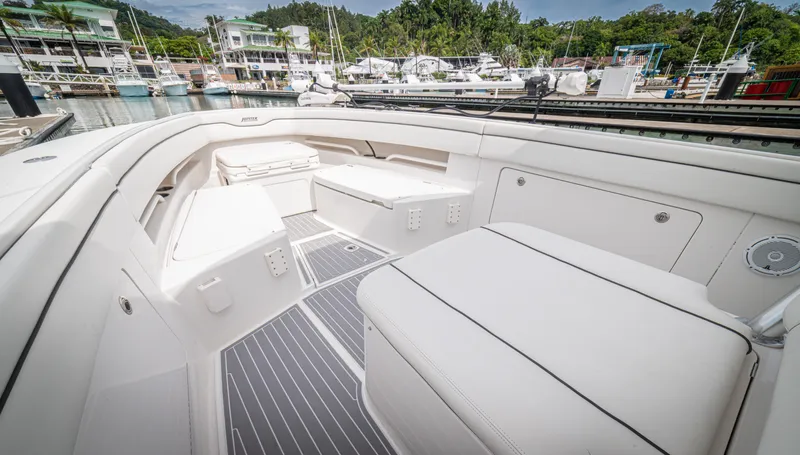 Half Nelson Yacht Photos Pics Luxurious 2016 Jupiter HFS boat interior with white seating and marina view.