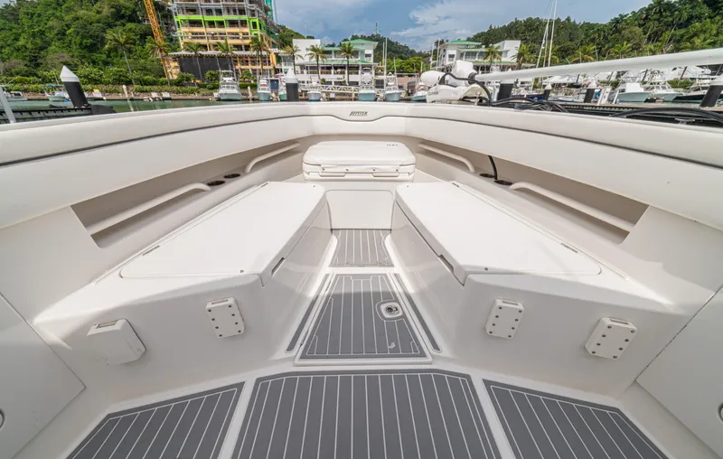 Half Nelson Yacht Photos Pics 2016 Jupiter HFS boat interior with seating and storage, docked at a marina.