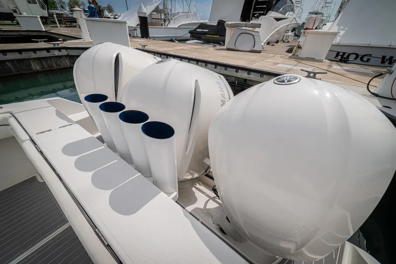 Half Nelson Yacht Photos Pics 2016 Jupiter HFS boat with powerful outboard engines docked at marina.