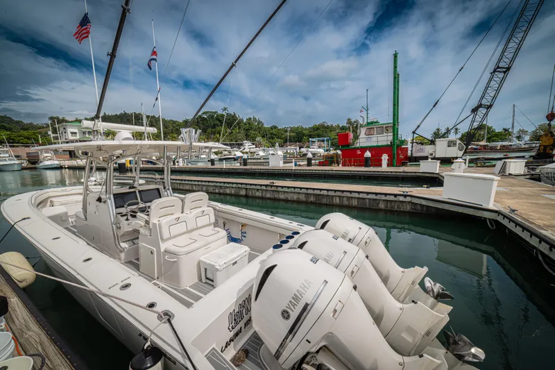 Half Nelson Yacht Photos Pics A 2016 Jupiter HFS boat docked in a marina with Yamaha engines.
