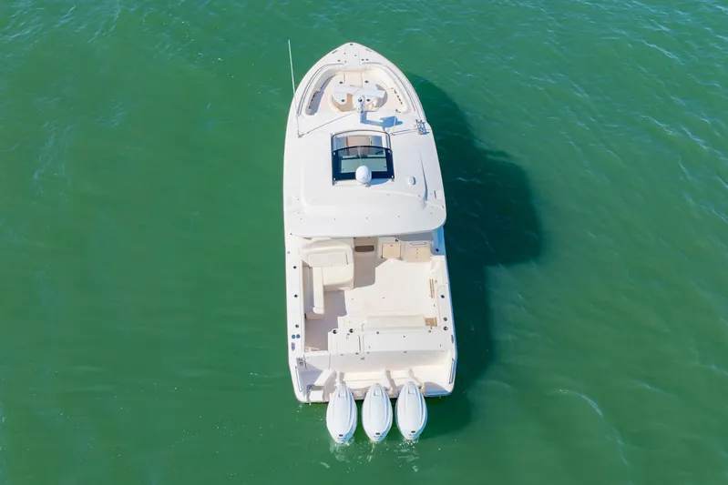  Yacht Photos Pics Aerial view of 2019 Grady-White Freedom 375 boat on green water.