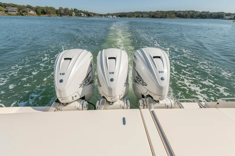  Yacht Photos Pics 2019 Grady-White Freedom 375 boat with triple V8 outboard engines on water.