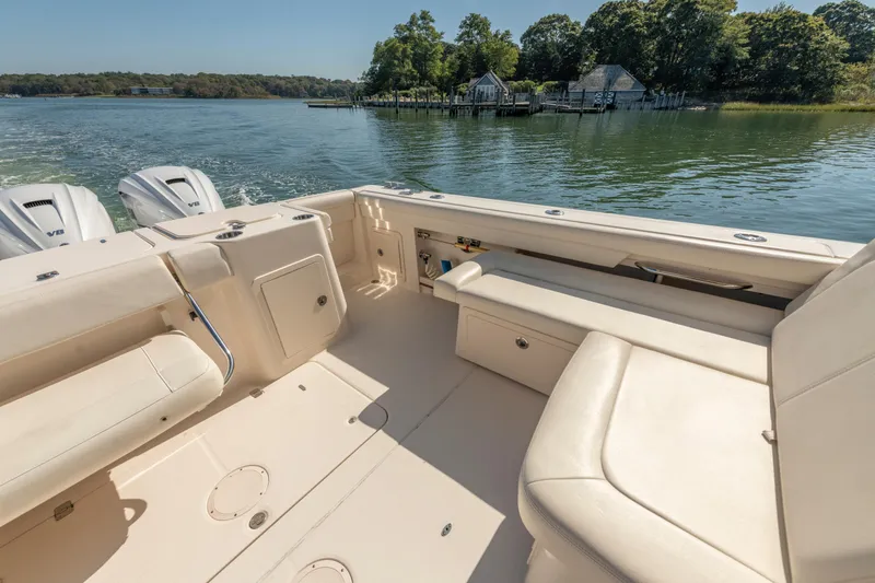  Yacht Photos Pics 2019 Grady-White Freedom 375 boat interior with seating, on a scenic lake.