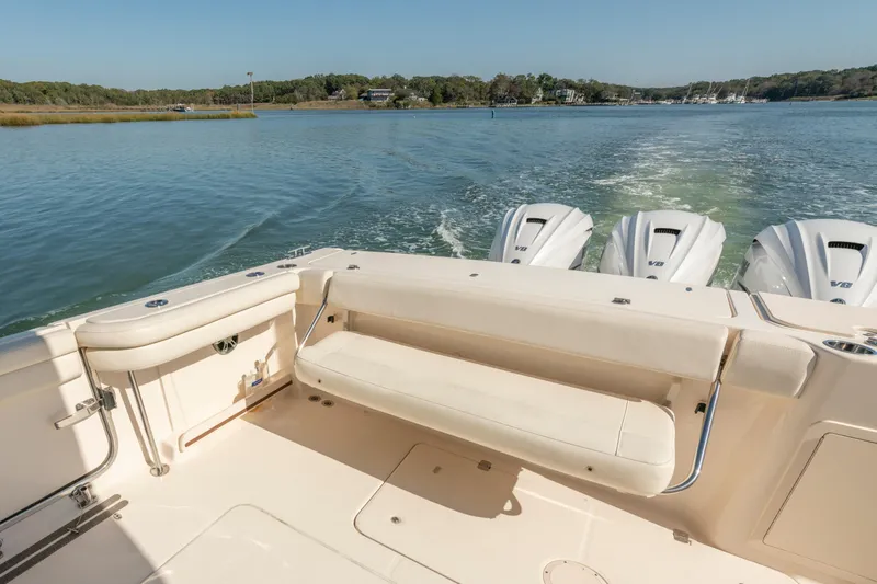  Yacht Photos Pics 2019 Grady-White Freedom 375 boat with triple V8 engines on a serene waterway.