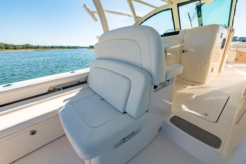  Yacht Photos Pics Luxurious interior of 2019 Grady-White Freedom 375 boat with plush seating and scenic water view.