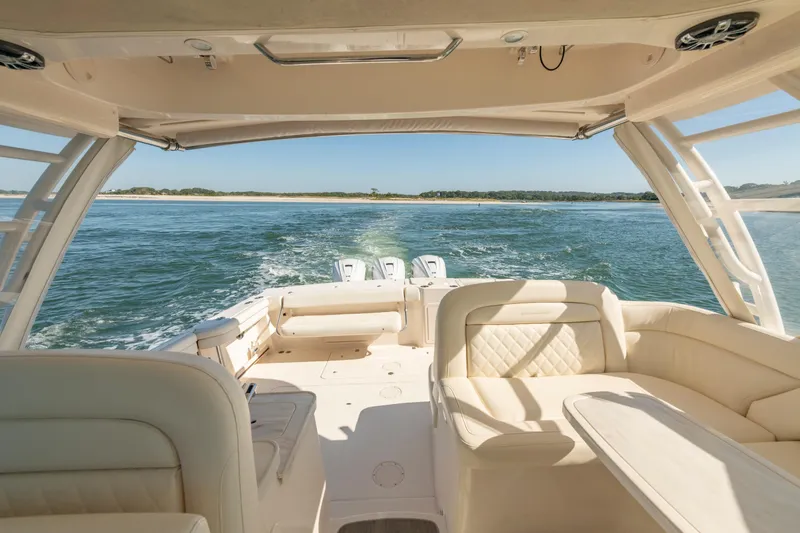  Yacht Photos Pics 2019 Grady-White Freedom 375 boat interior with ocean view, featuring luxurious seating.