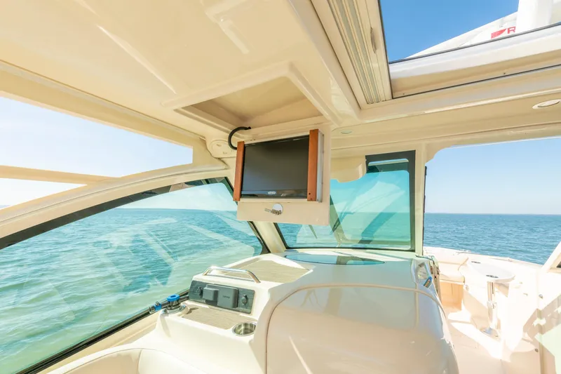  Yacht Photos Pics 2019 Grady-White Freedom 375 boat interior with ocean view and mounted screen.