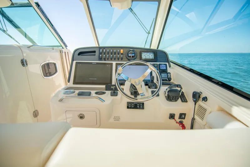  Yacht Photos Pics 2019 Grady-White Freedom 375 boat helm with modern navigation controls and ocean view.