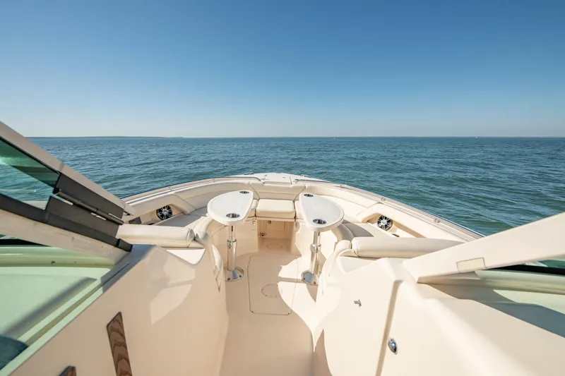 Yacht Photos Pics 2019 Grady-White Freedom 375 boat on open water, featuring spacious seating and tables.