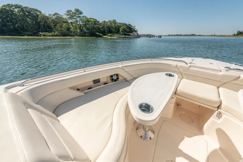  Yacht Photos Pics Luxurious seating area on 2019 Grady-White Freedom 375 boat, overlooking serene waters.