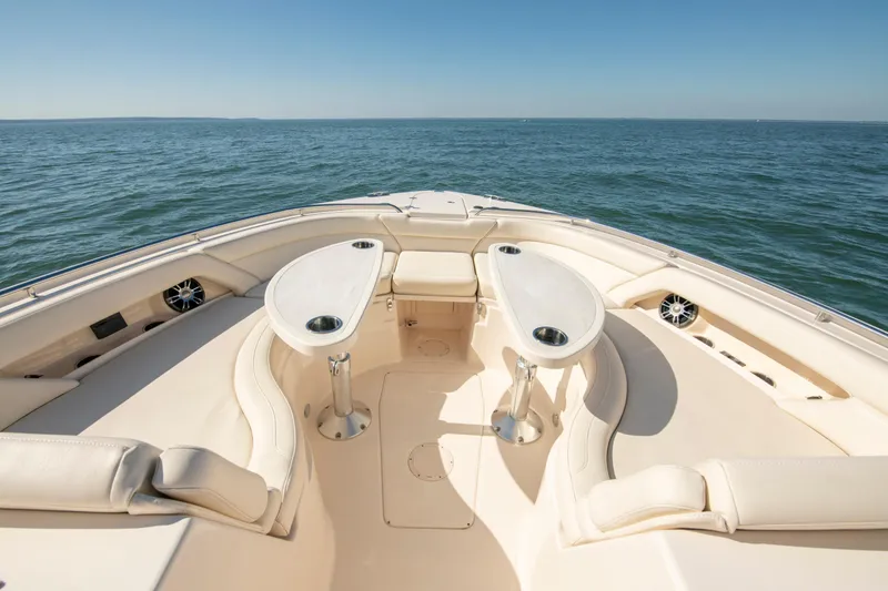  Yacht Photos Pics Luxurious 2019 Grady-White Freedom 375 boat interior with seating and tables on open water.