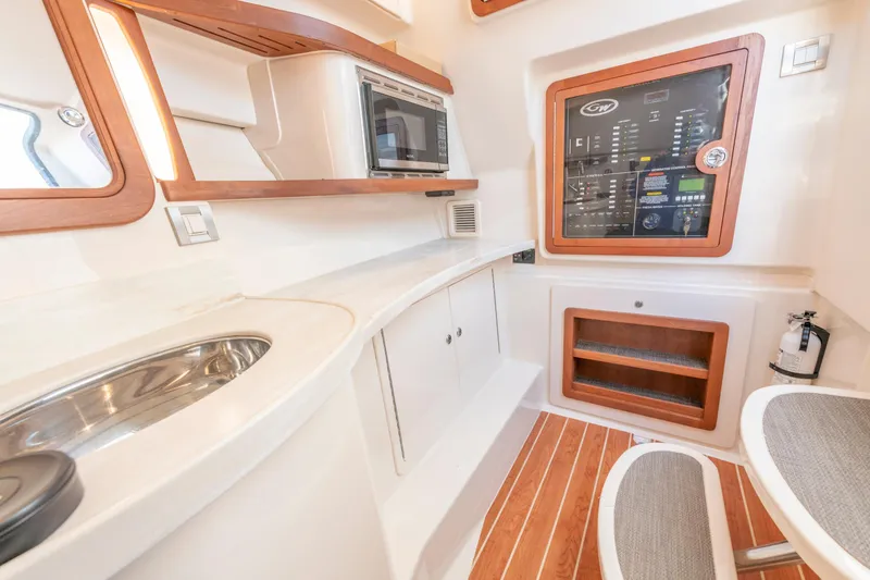  Yacht Photos Pics Interior of 2019 Grady-White Freedom 375 boat with modern amenities and control panel.