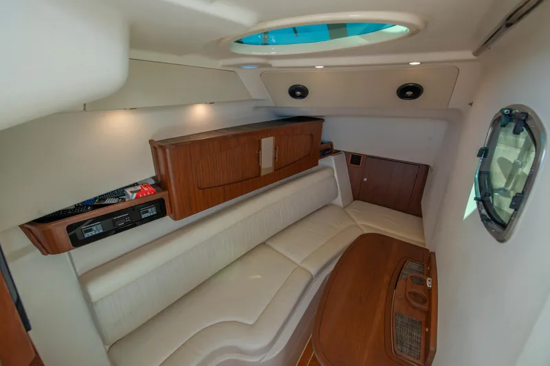  Yacht Photos Pics Luxurious interior of 2019 Grady-White Freedom 375 boat with plush seating and wooden accents.