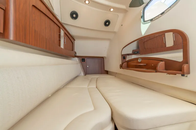  Yacht Photos Pics Luxurious cabin interior of 2019 Grady-White Freedom 375 boat with wood accents.