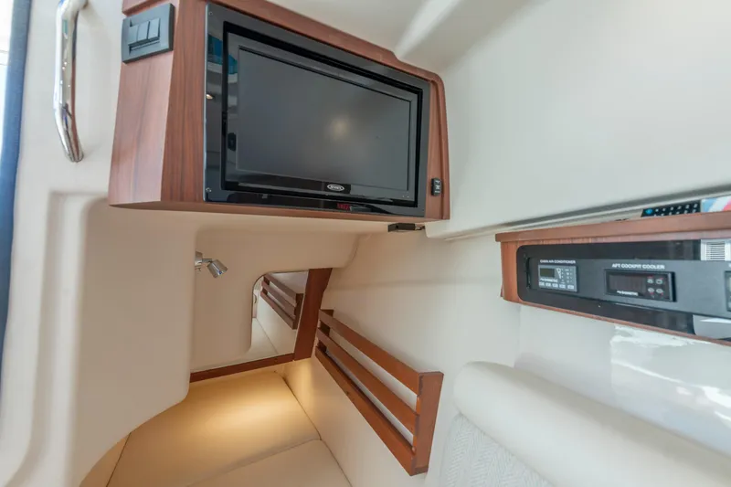  Yacht Photos Pics 2019 Grady-White Freedom 375 cabin interior with TV and control panel.