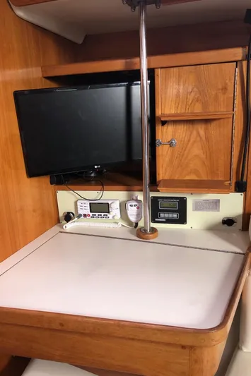 Papa Bob Yacht Photos Pics Navigation station in 1996 Catalina 42 MkII sailboat with TV and control panel.