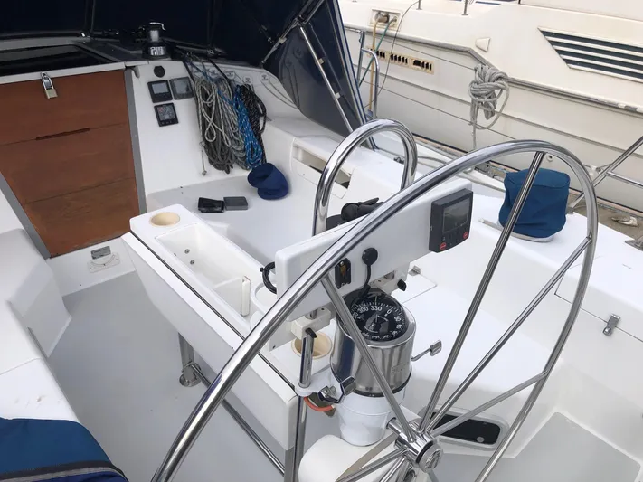 Papa Bob Yacht Photos Pics 1996 Catalina 42 MkII sailboat cockpit with steering wheel and navigation instruments.
