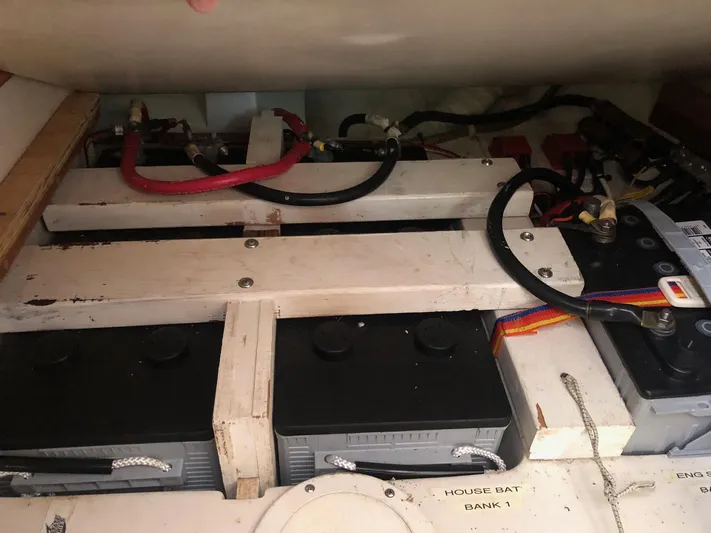 Papa Bob Yacht Photos Pics Battery compartment of a 1996 Catalina 42 MkII sailboat, showing multiple batteries and wiring.