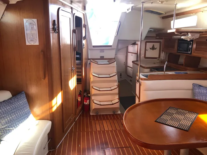 Papa Bob Yacht Photos Pics Interior of a 1996 Catalina 42 MkII sailboat with wooden finishes and cozy seating.