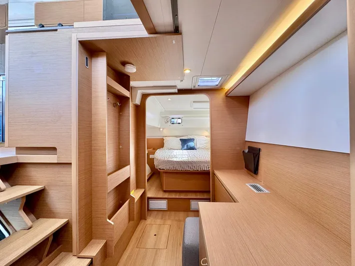 Sea SeÑora Yacht Photos Pics Luxurious interior of 2023 Excess 12 yacht with modern wood finish and cozy bedroom.