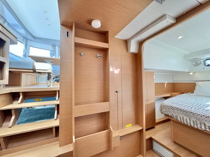 Sea SeÑora Yacht Photos Pics 2023 Excess 12 yacht interior with modern wood finish and cozy sleeping area.