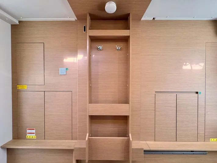 Sea SeÑora Yacht Photos Pics Interior of 2023 Excess 12 yacht with wooden paneling and storage compartments.