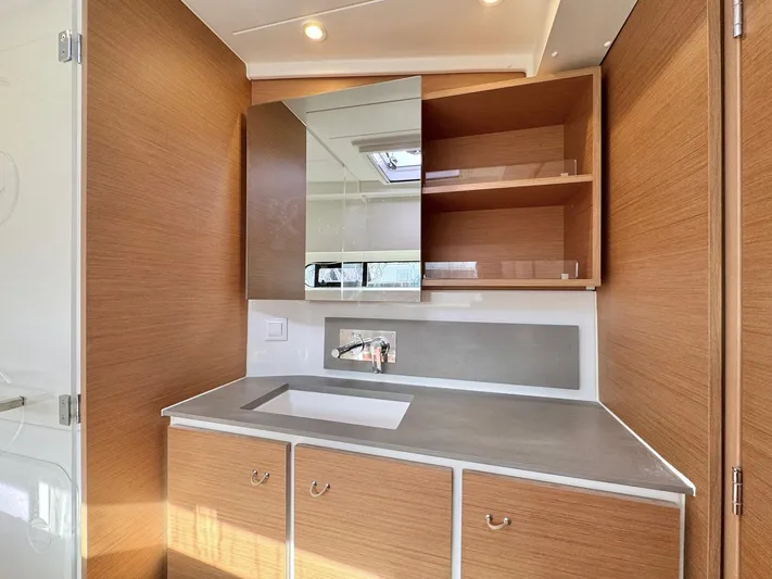 Sea SeÑora Yacht Photos Pics Modern bathroom vanity in 2023 Excess 12 yacht with wood cabinets and mirror.