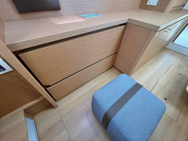 Sea SeÑora Yacht Photos Pics 2023 Excess 12 interior with wooden cabinetry and a cushioned stool.