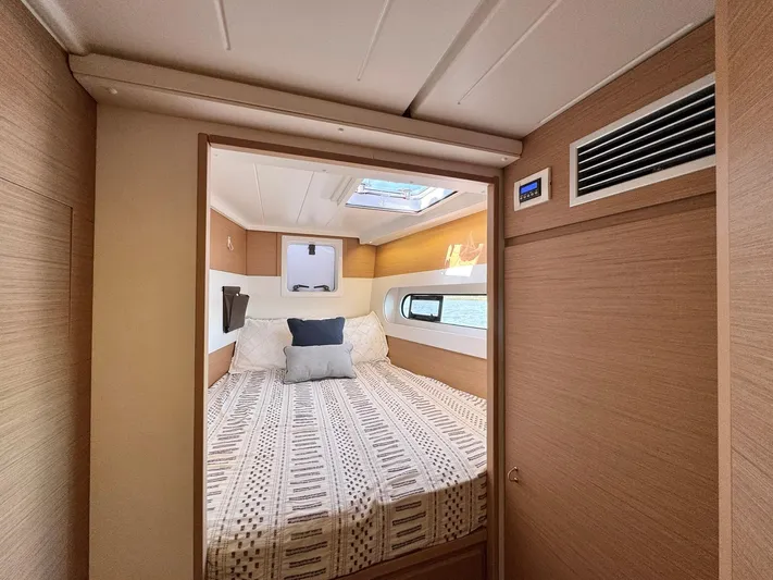 Sea SeÑora Yacht Photos Pics 2023 Excess 12 yacht cabin with cozy bed, skylight, and modern wood paneling.