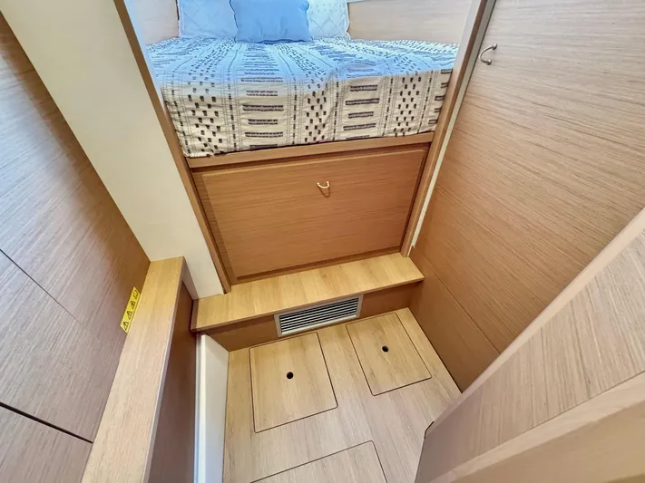 Sea SeÑora Yacht Photos Pics Cozy cabin interior of 2023 Excess 12 yacht with wooden finish and bed.