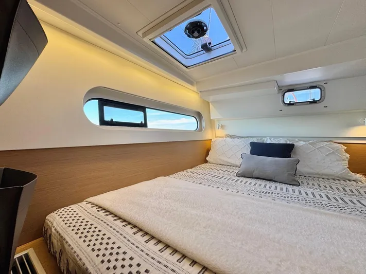 Sea SeÑora Yacht Photos Pics Luxurious cabin interior of 2023 Excess 12 yacht with cozy bedding and skylight.