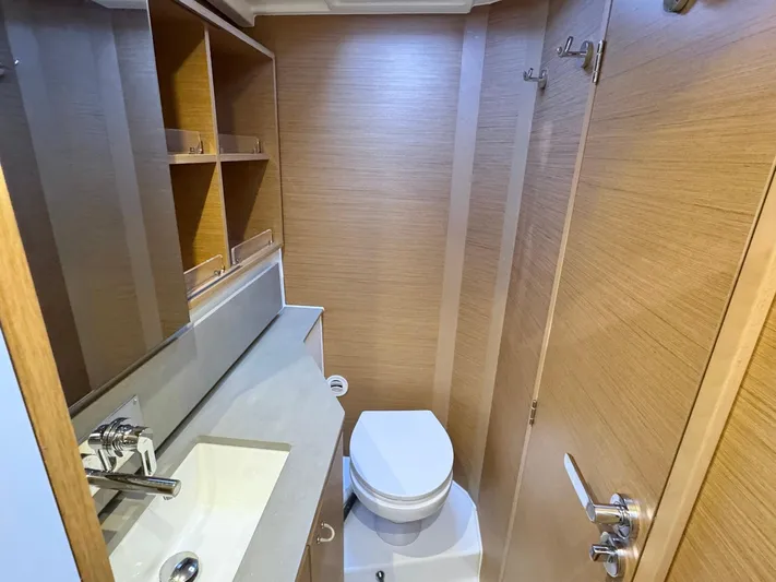 Sea SeÑora Yacht Photos Pics Modern bathroom in 2023 Excess 12 yacht with sink, toilet, and wooden cabinetry.