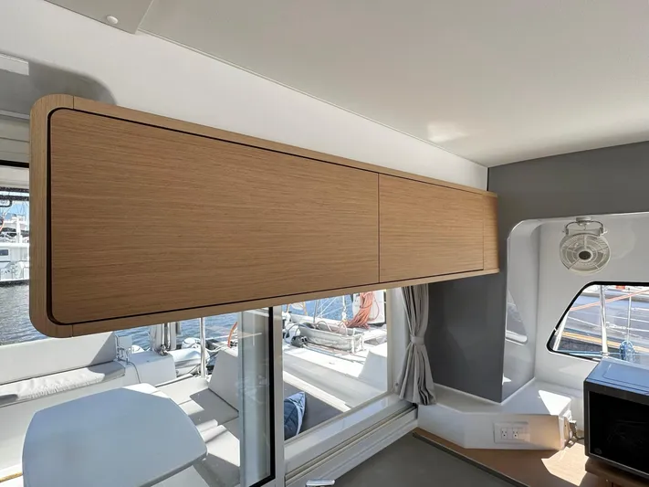 Sea SeÑora Yacht Photos Pics Interior of 2023 Excess 12 yacht with wooden cabinetry and large windows.