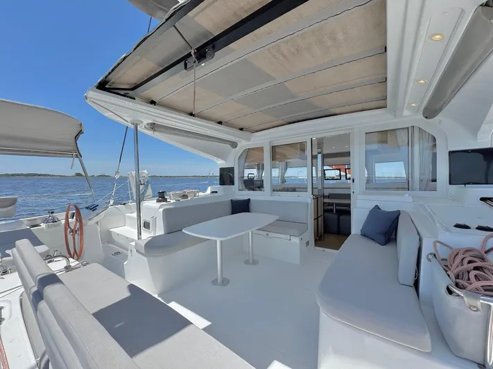Sea SeÑora Yacht Photos Pics Luxurious 2023 Excess 12 catamaran with spacious deck and seating, overlooking serene ocean view.