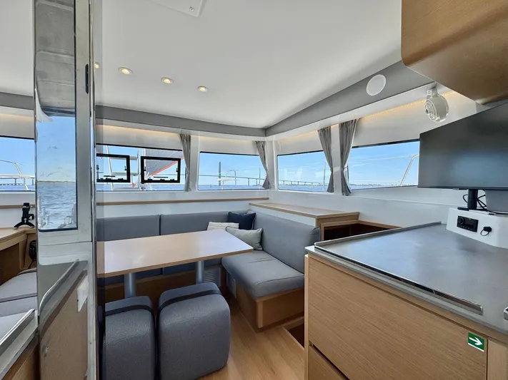 Sea SeÑora Yacht Photos Pics Modern interior of 2023 Excess 12 catamaran with panoramic windows and sleek furnishings.