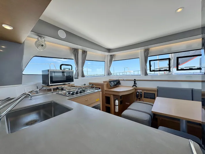 Sea SeÑora Yacht Photos Pics Modern interior of 2023 Excess 12 catamaran with kitchen and dining area.
