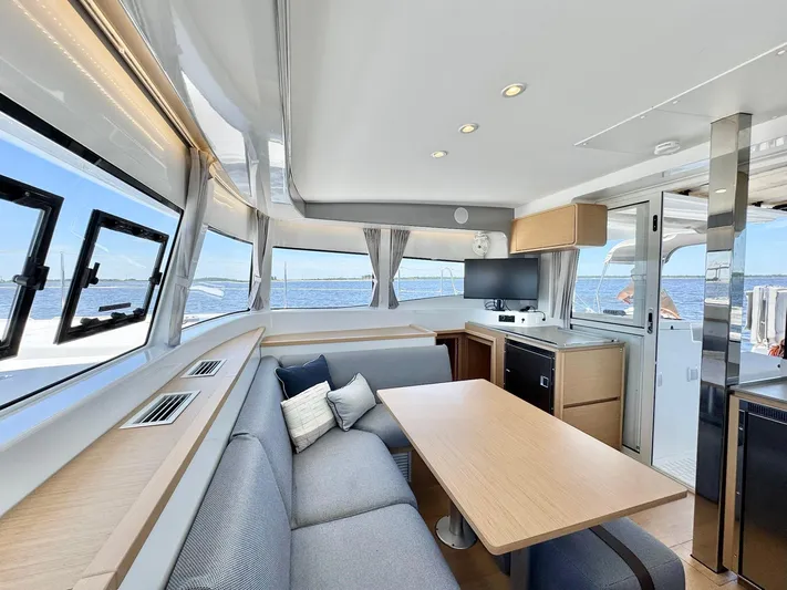 Sea SeÑora Yacht Photos Pics Luxurious interior of 2023 Excess 12 yacht with modern seating and ocean view.