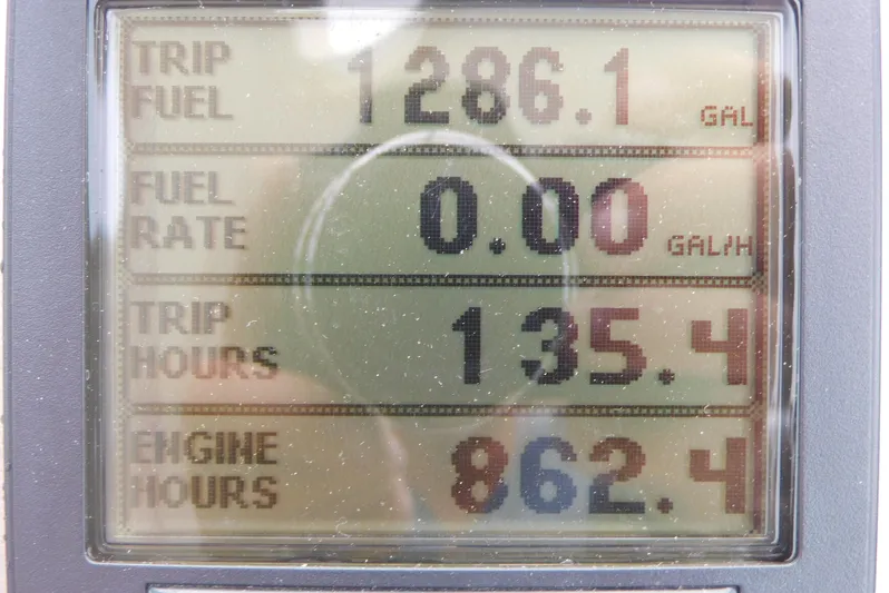 Just One More Yacht Photos Pics Display screen showing trip fuel, fuel rate, trip hours, and engine hours for 2005 Cruisers Yachts 520 Express.
