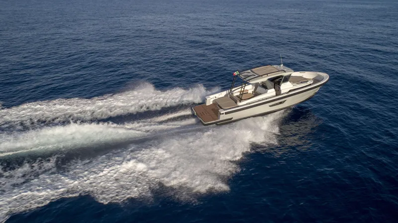 Bg42-49 Yacht Photos Pics 2023 Bluegame BG42 yacht cruising on open sea, creating dynamic water trails.