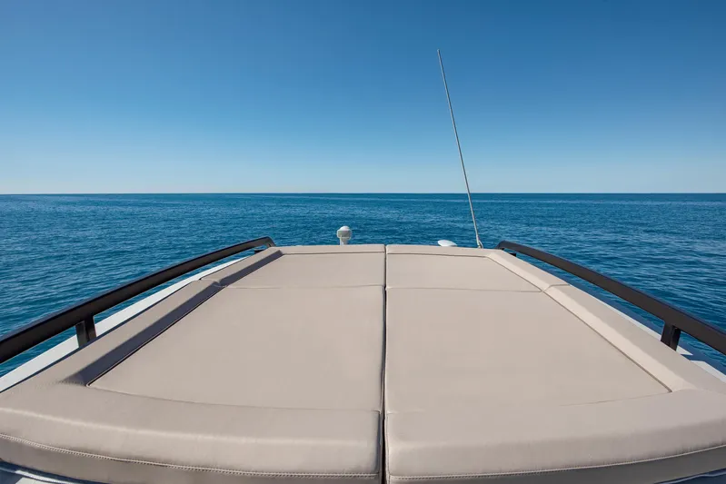 Bg42-49 Yacht Photos Pics 2023 Bluegame BG42 yacht deck with ocean view under clear blue sky.