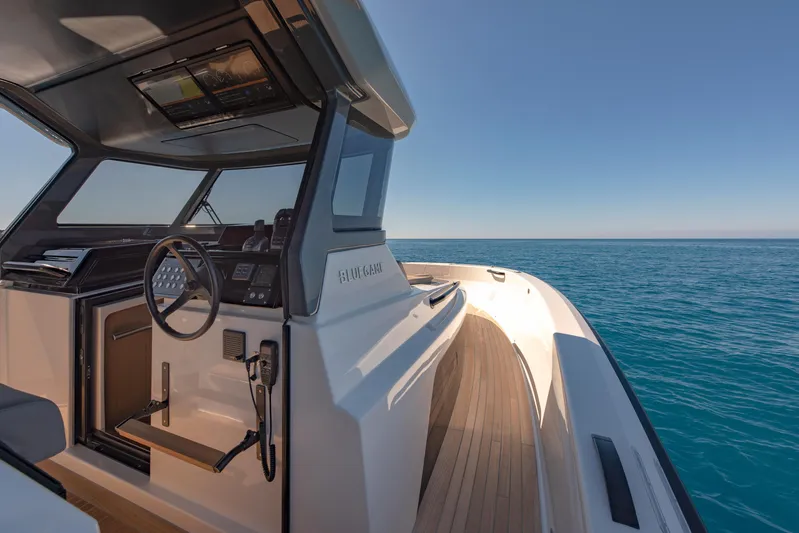 Bg42-49 Yacht Photos Pics 2023 Bluegame BG42 yacht cockpit with ocean view, featuring sleek design and modern controls.