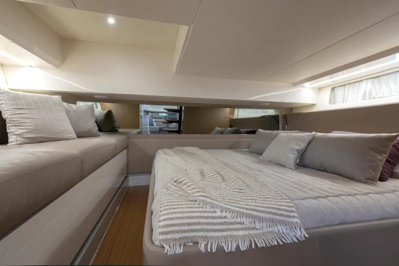 Bg42-49 Yacht Photos Pics Luxurious interior of 2023 Bluegame BG42 yacht with cozy bedding and modern design.