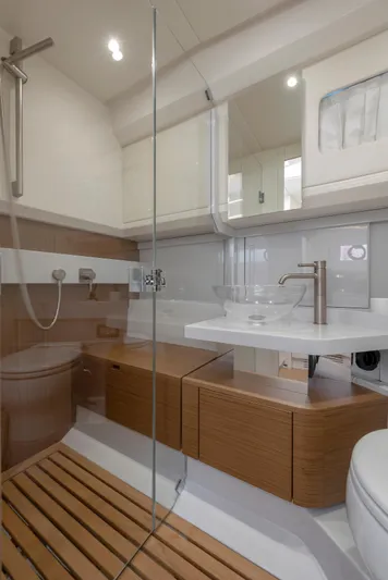 Bg42-49 Yacht Photos Pics Modern bathroom in 2023 Bluegame BG42 yacht with sleek fixtures and wooden accents.