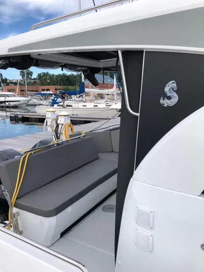 Boondoggle Yacht Photos Pics 2022 Beneteau Antares 11 boat with sleek design, docked at marina.