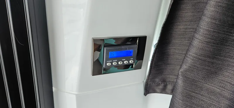 Boondoggle Yacht Photos Pics Control panel on 2022 Beneteau Antares 11 boat, featuring digital display and buttons.