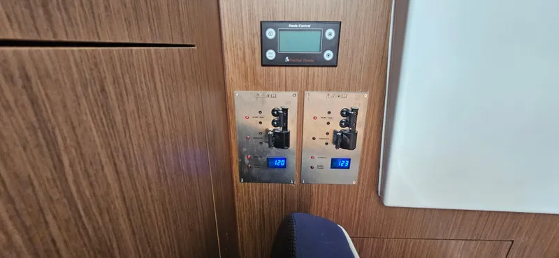 Boondoggle Yacht Photos Pics Control panel of 2022 Beneteau Antares 11 boat, featuring digital displays and switches.